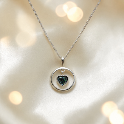 Wren silver open circle with heart drop ashes pendant in black flame, handcrafted in Lancashire UK