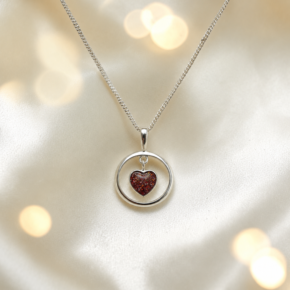 Wren silver open circle with heart drop ashes pendant in copper mocha, handcrafted in Lancashire UK