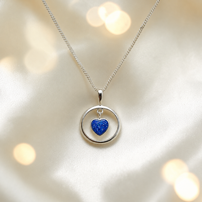 Wren silver open circle with heart drop ashes pendant in royal blue, handcrafted in Lancashire UK