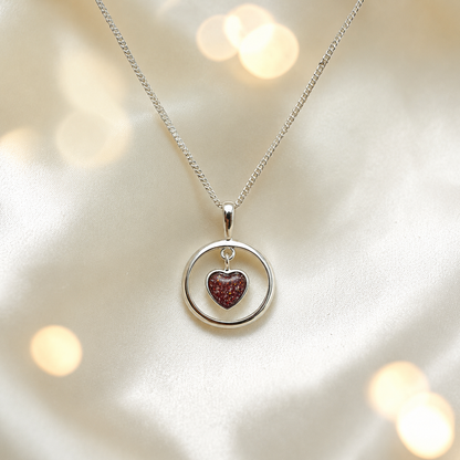 Wren silver open circle with heart drop ashes pendant in ruby red, handcrafted in Lancashire UK