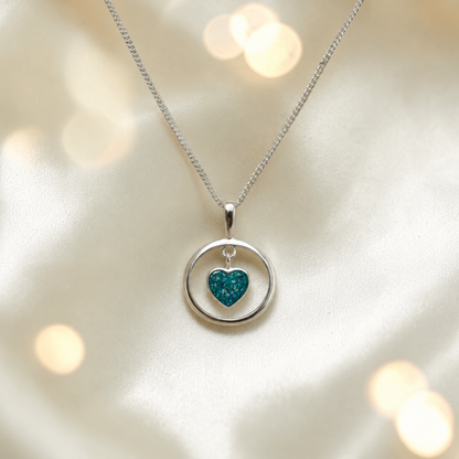 Wren silver open circle with heart drop ashes pendant in teal mist, handcrafted in Lancashire UK 