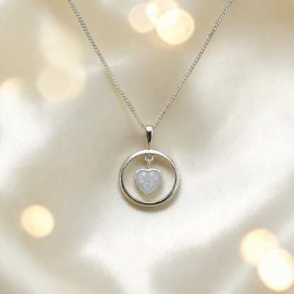 Wren silver open circle with heart drop ashes pendant in white snow, handcrafted in Lancashire UK 