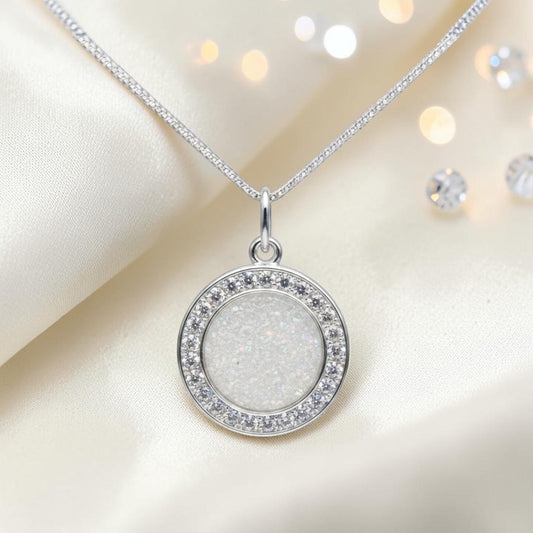 Zosma round memorial locket with CZ stones in white snow, handcrafted in Lancashire UK  by Keepsake Memorial Jewellery
